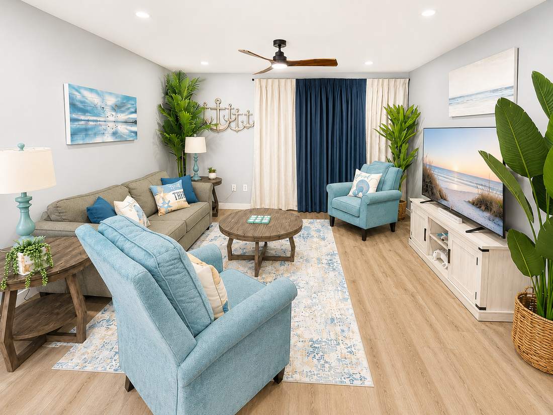 Bright living room with comfy seating and large TV